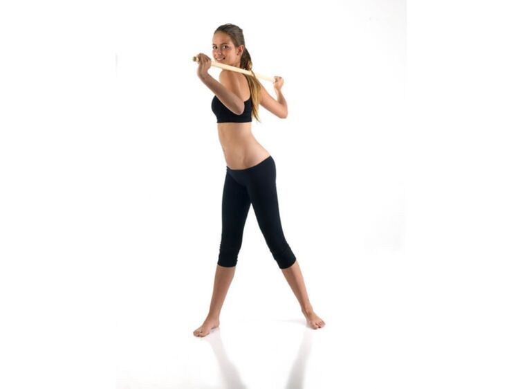 Exercise with a stick to strengthen and build back muscles for thoracic osteochondrosis
